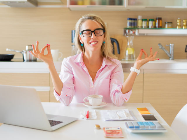 girl meditating at home office by Kaspar Grinvalds shutterstock_1170497668