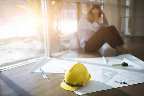 stressed construction workder by CrispyPork shutterstock_745589800