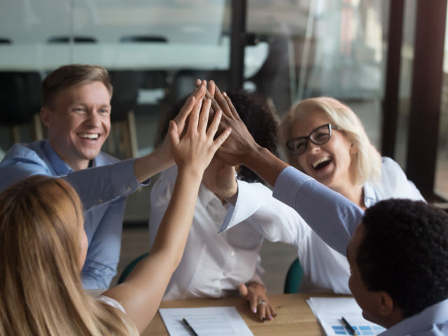 happy team by fiskes shutterstock_1322813228 (1)