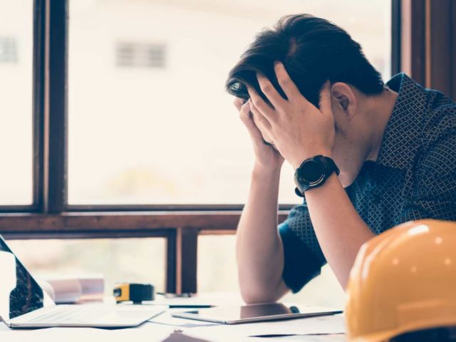 construction worker stressed shutterstock_1049472359